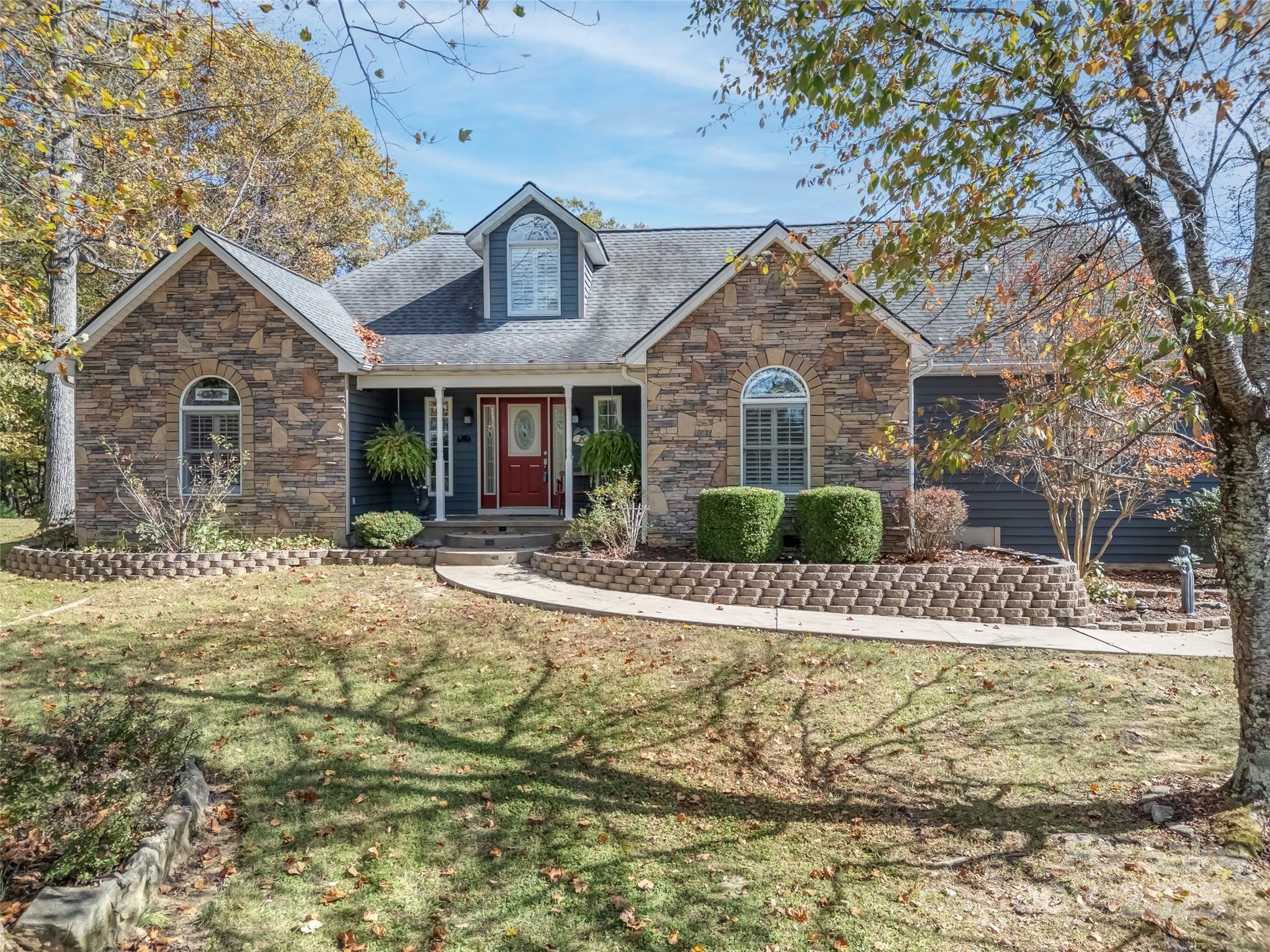 a front view of a house with garden