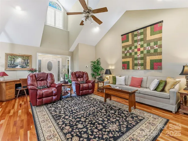 a living room with furniture and a rug