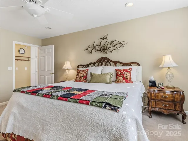 a bedroom with a bed and a table