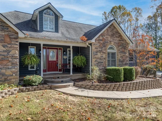 a front view of a house with garden