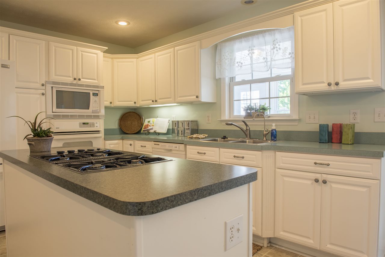 95 Lea Port Road Mount Sidney, VA 24467 - Photo 11 of 37 a kitchen with kitchen island granite countertop a sink cabinets and window