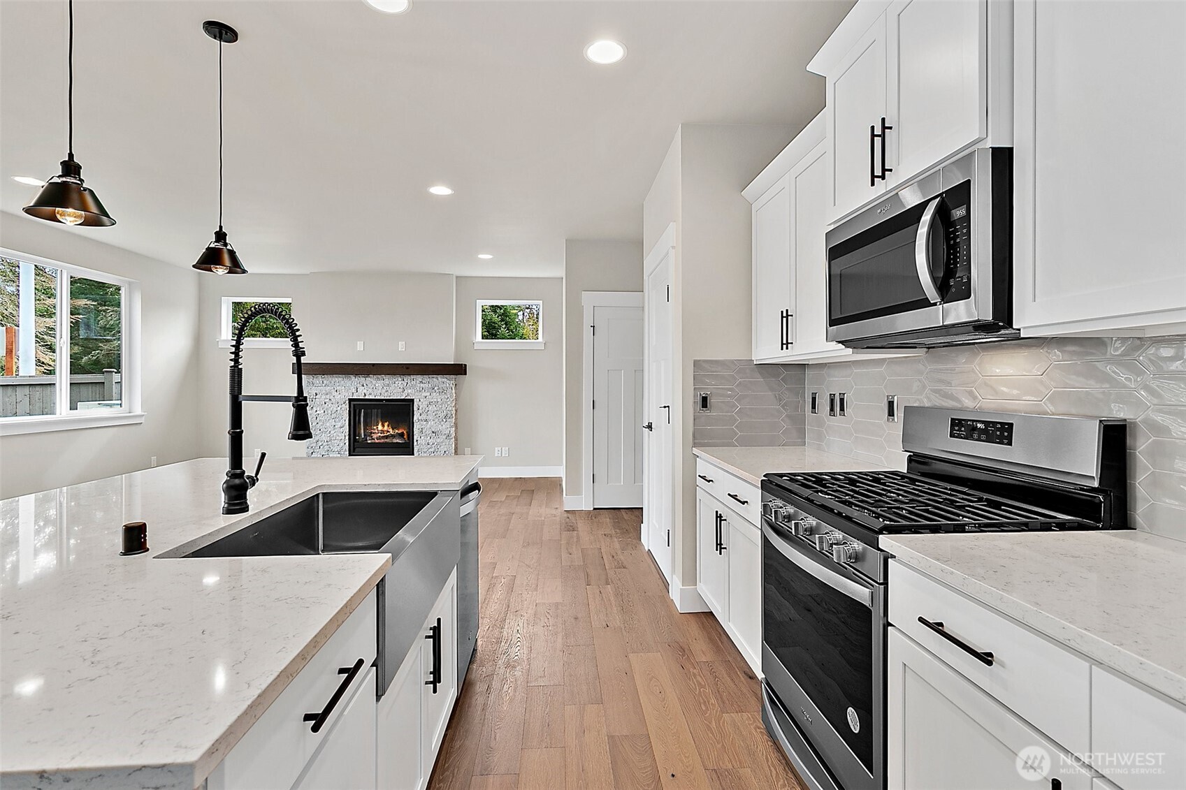 18510 Meridian Avenue Southeast, Unit CR 02 Bothell, WA 98012 - Photo 13 of 31 a kitchen with stainless steel appliances a stove microwave and cabinets
