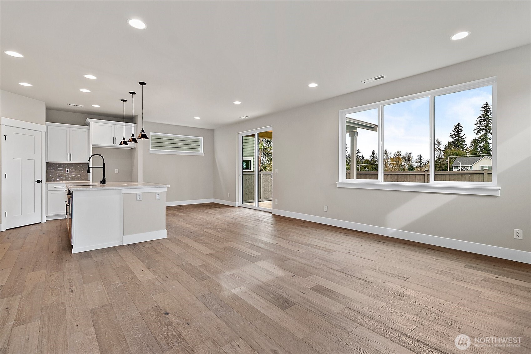 18510 Meridian Avenue Southeast, Unit CR 02 Bothell, WA 98012 - Photo 6 of 31 a view of a kitchen with furniture and wooden floor