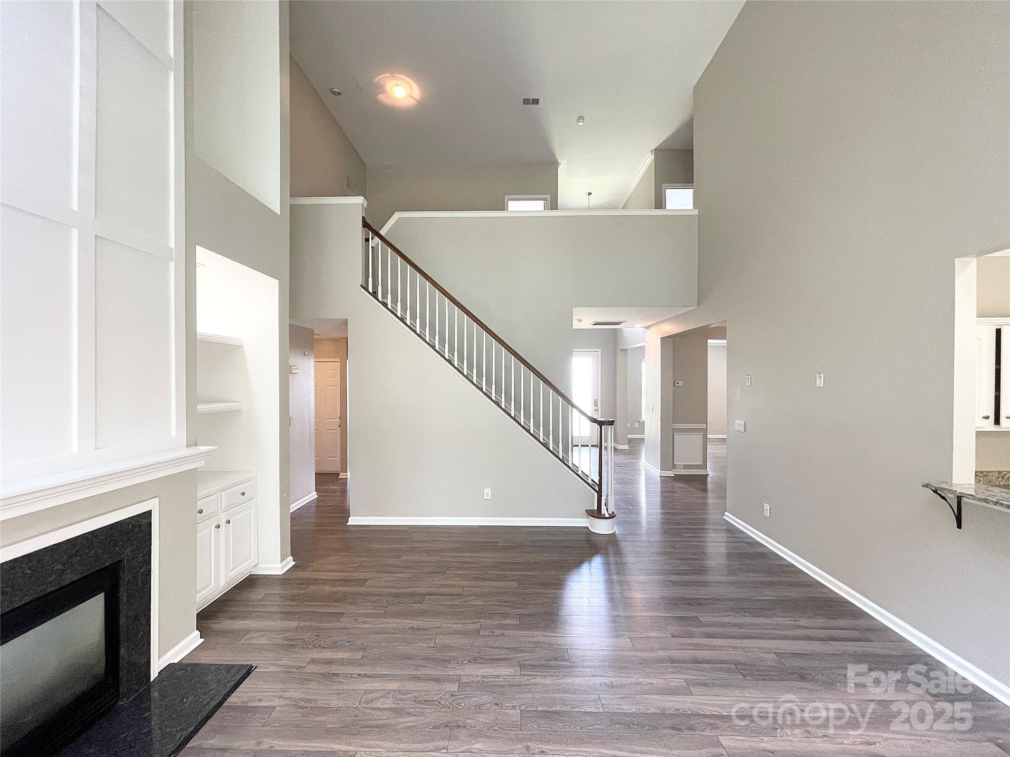 2834 Ritz Lane Matthews, NC 28105 - Photo 13 of 32 a view of entryway and hall with wooden floor