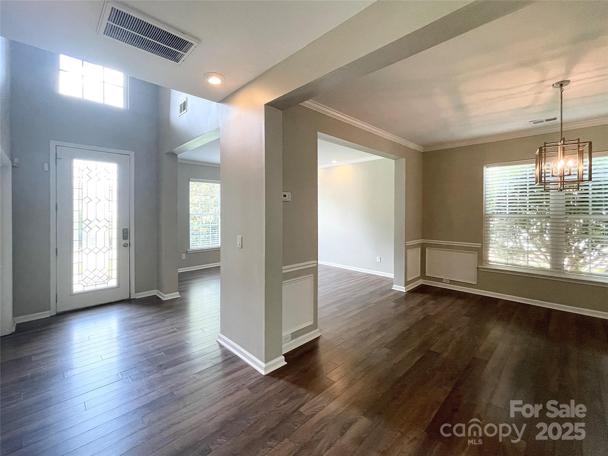 2834 Ritz Lane Matthews, NC 28105 - Photo 17 of 32 an empty room with wooden floor and windows