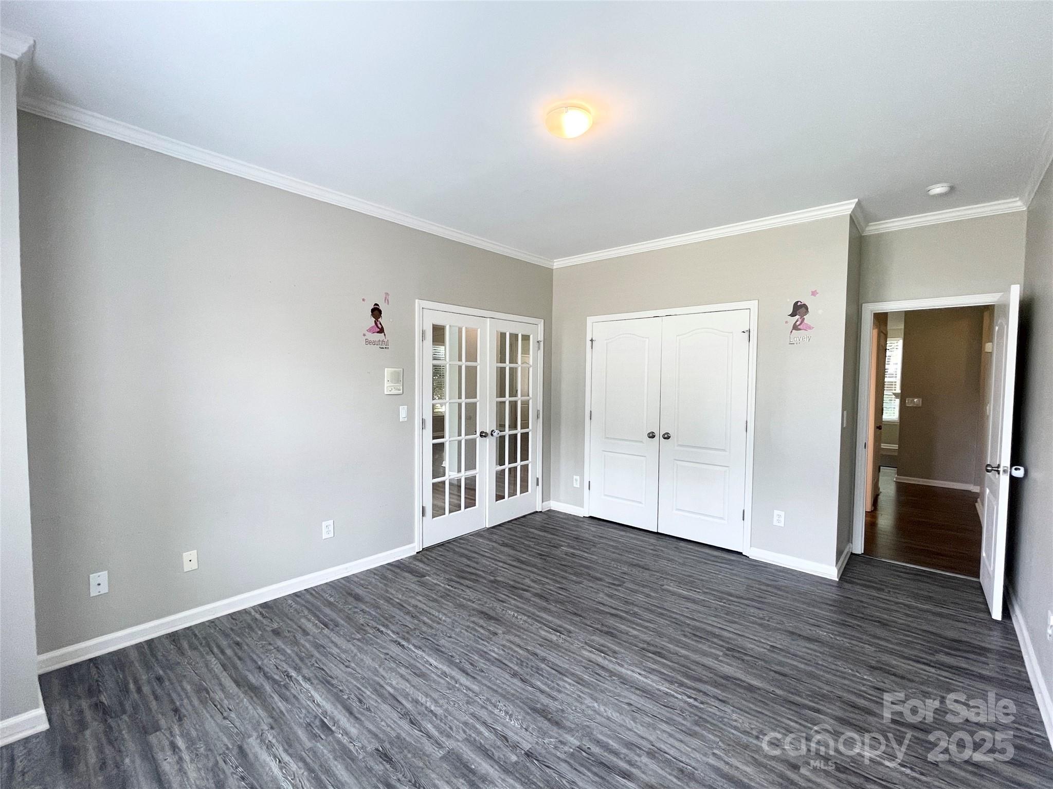 2834 Ritz Lane Matthews, NC 28105 - Photo 21 of 32 wooden floor in an empty room with a window