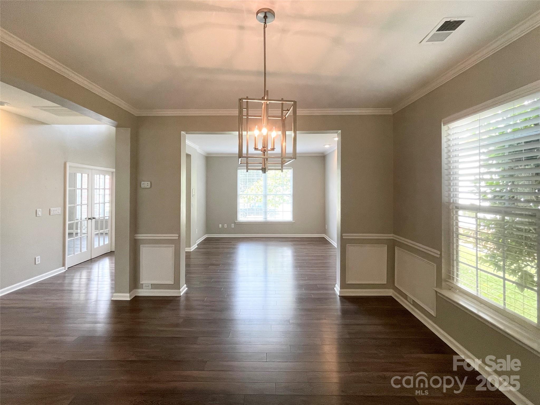 2834 Ritz Lane Matthews, NC 28105 - Photo 3 of 32 a view of a room with wooden floor and windows