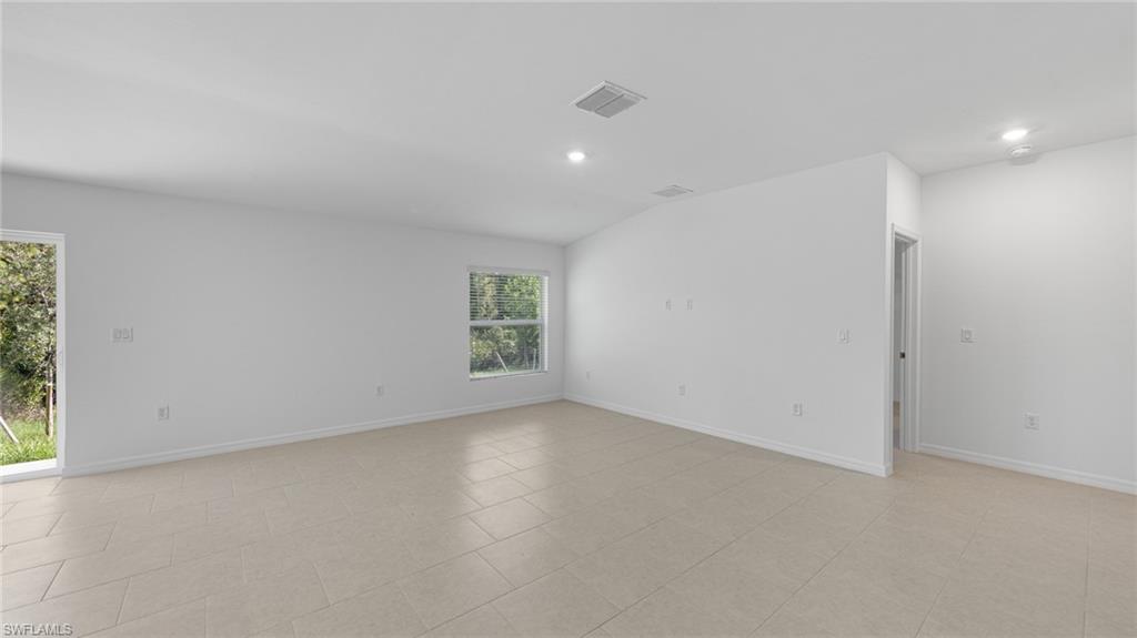 156 Peerless Street Lehigh Acres, FL 33974 - Photo 20 of 26 an empty room with a window