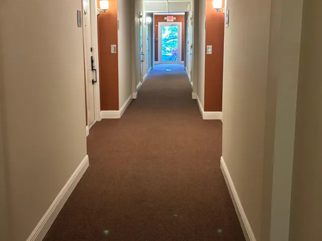 a view of a hallway with an empty room
