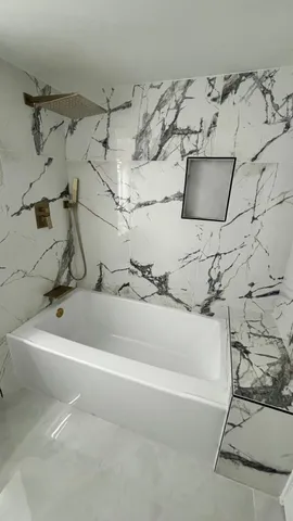 a view of a bathtub in a bathroom
