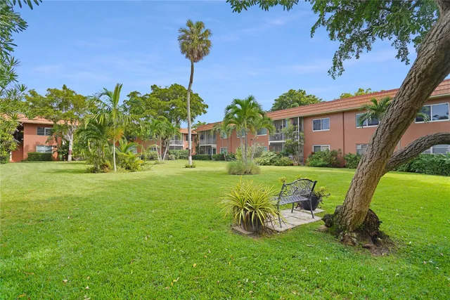 a view of a table and chairs in the garden