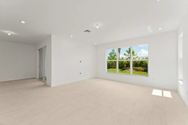 a view of an empty room with a window