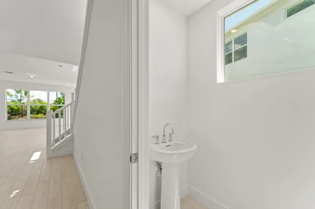 a bathroom with a sink and mirror
