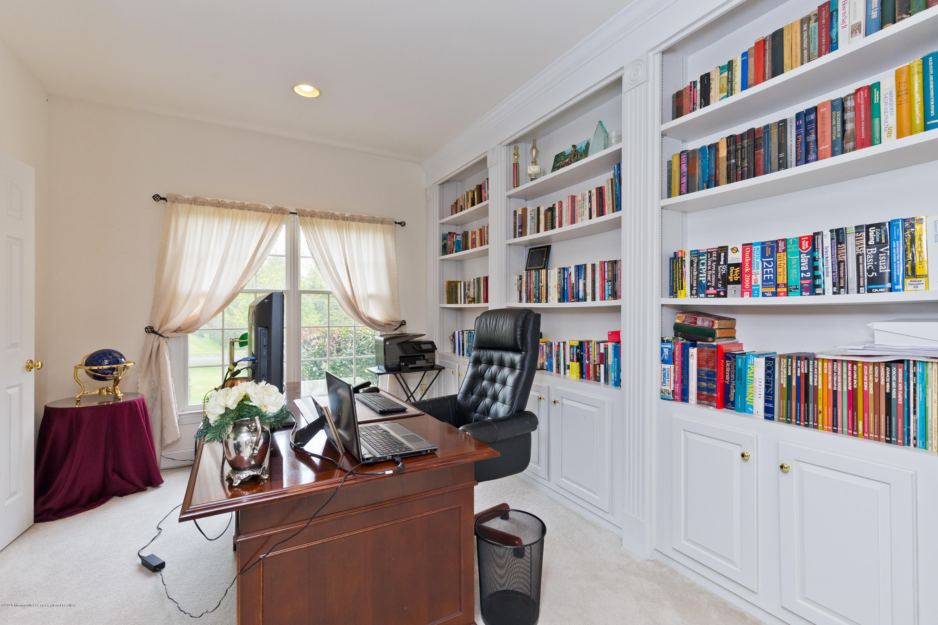 158 Otto Road Neshanic Station, NJ 08853 - Photo 17 of 50 a room with bookshelf and a workspace