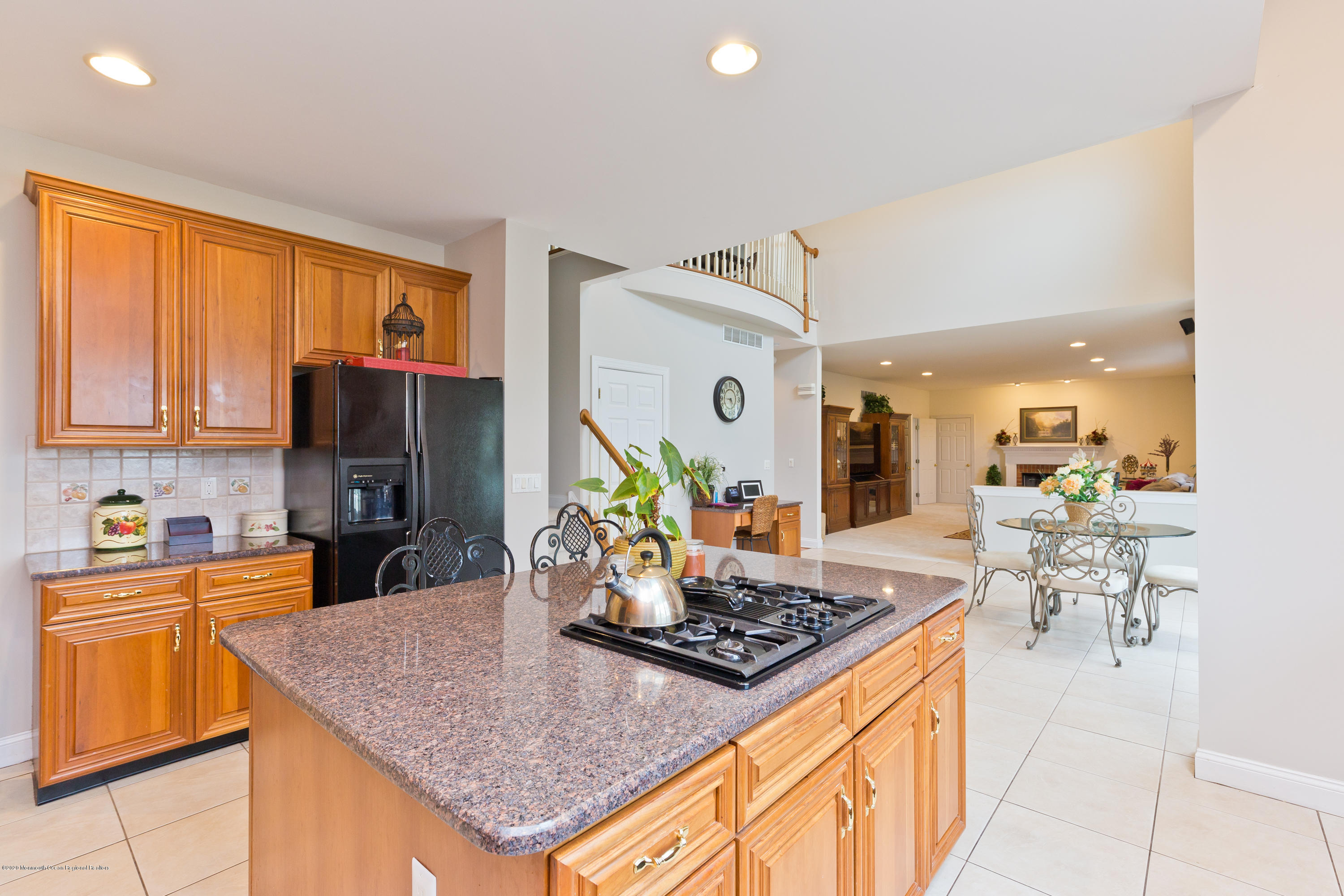 158 Otto Road Neshanic Station, NJ 08853 - Photo 29 of 50 a kitchen with a stove a sink dishwasher and a dining table with cabinets