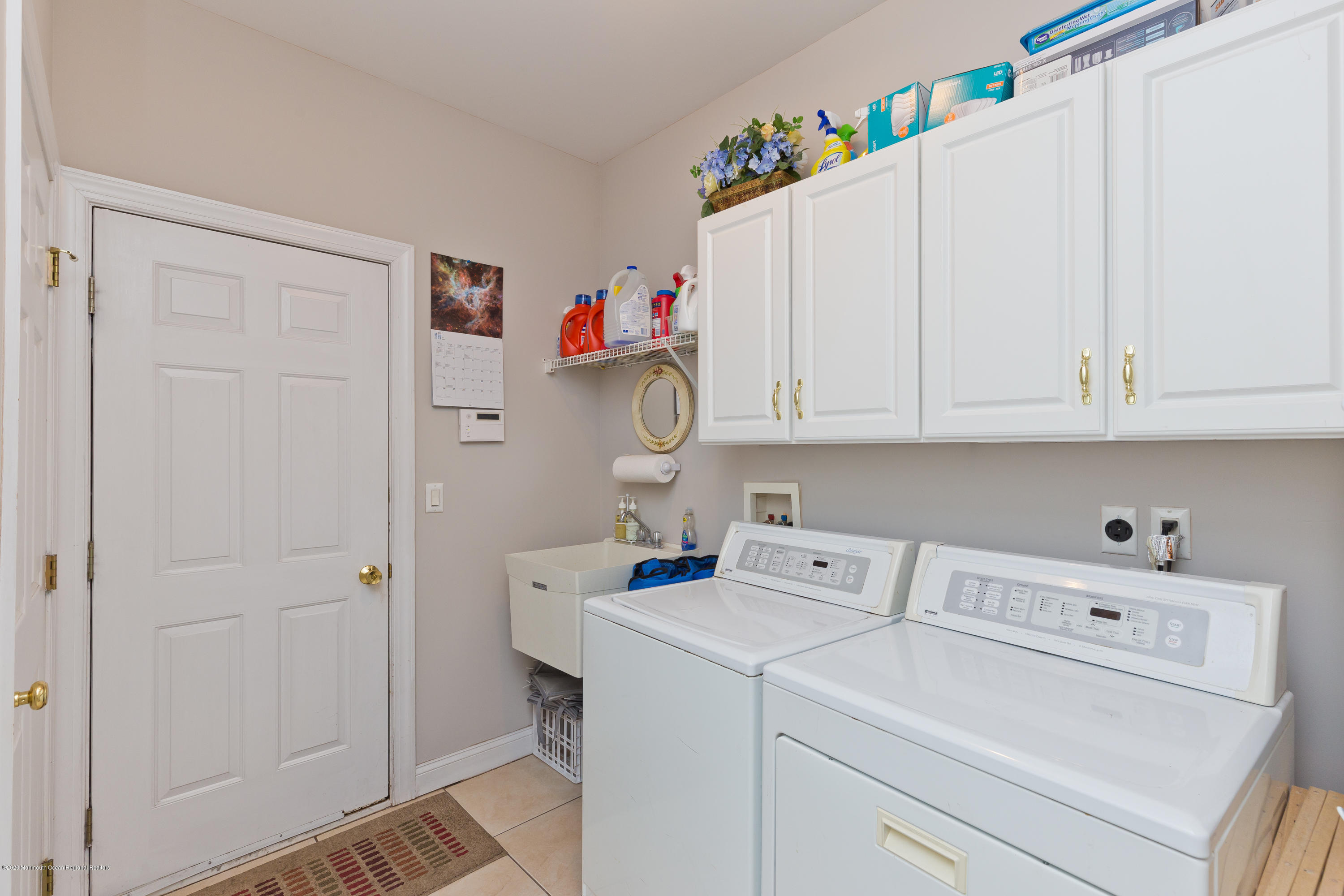 158 Otto Road Neshanic Station, NJ 08853 - Photo 30 of 50 a view of storage and utility room with washer and dryer