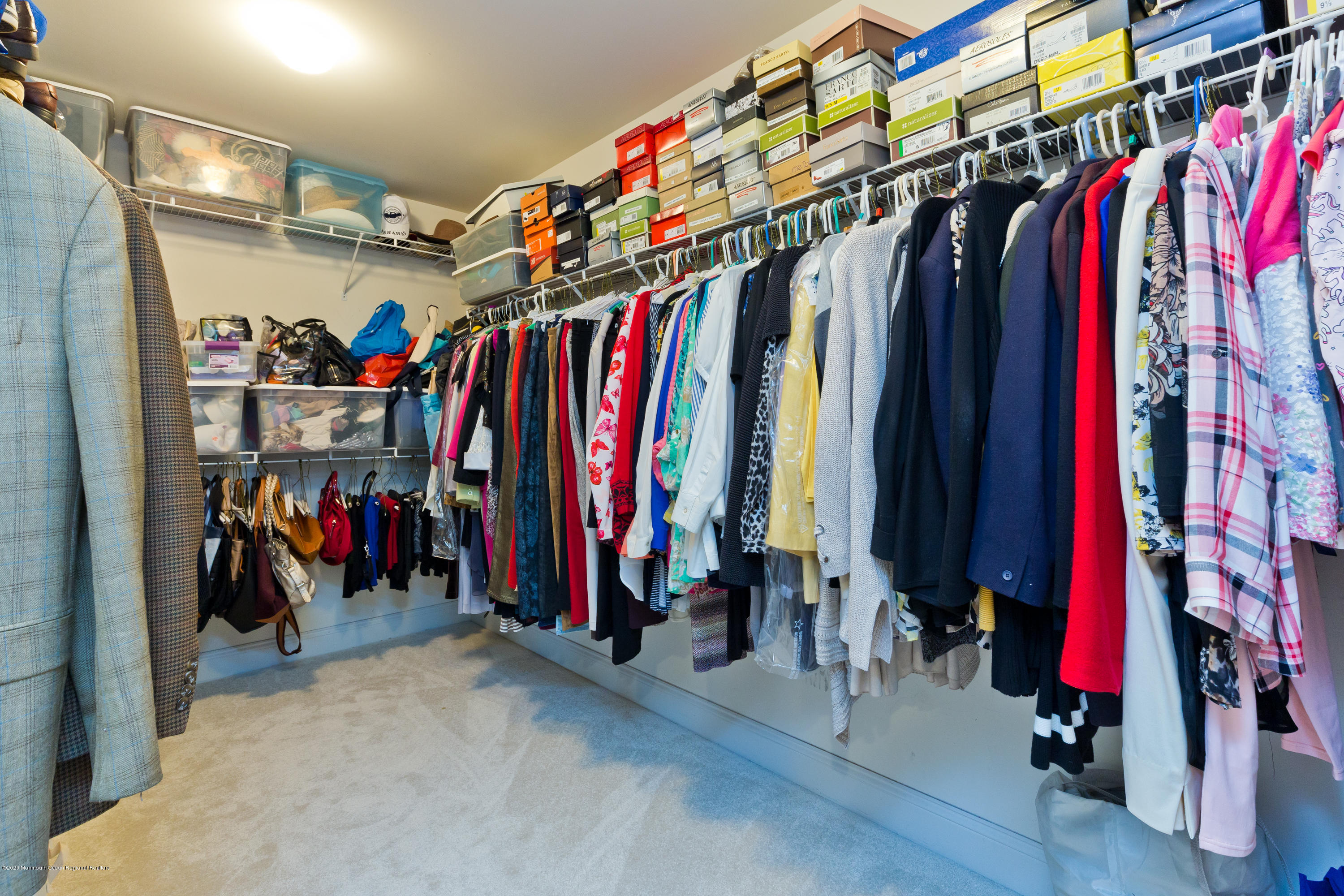 158 Otto Road Neshanic Station, NJ 08853 - Photo 39 of 50 a view of walk in closet with clothes