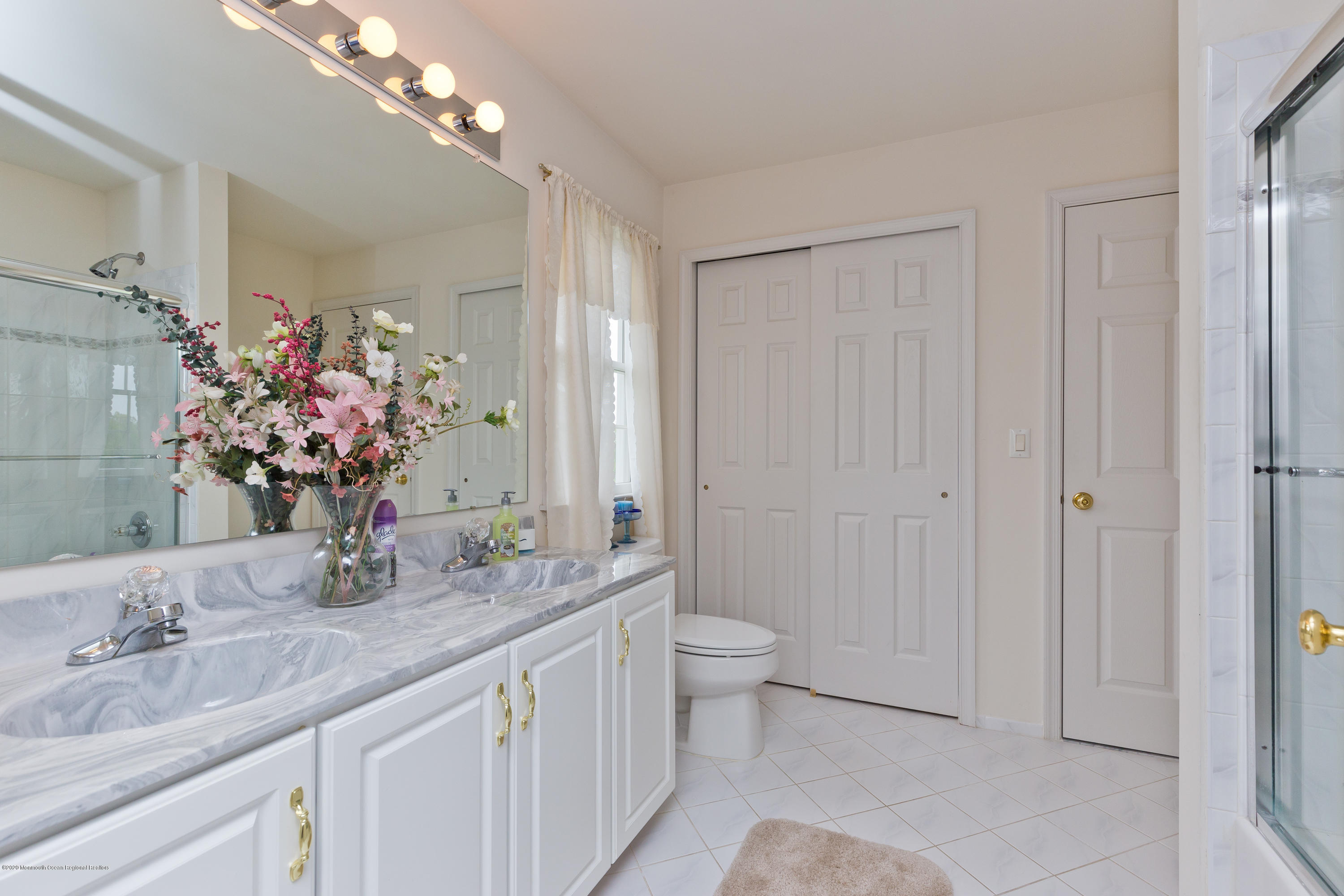 158 Otto Road Neshanic Station, NJ 08853 - Photo 47 of 50 a bathroom with a granite countertop sink a large mirror and a shower