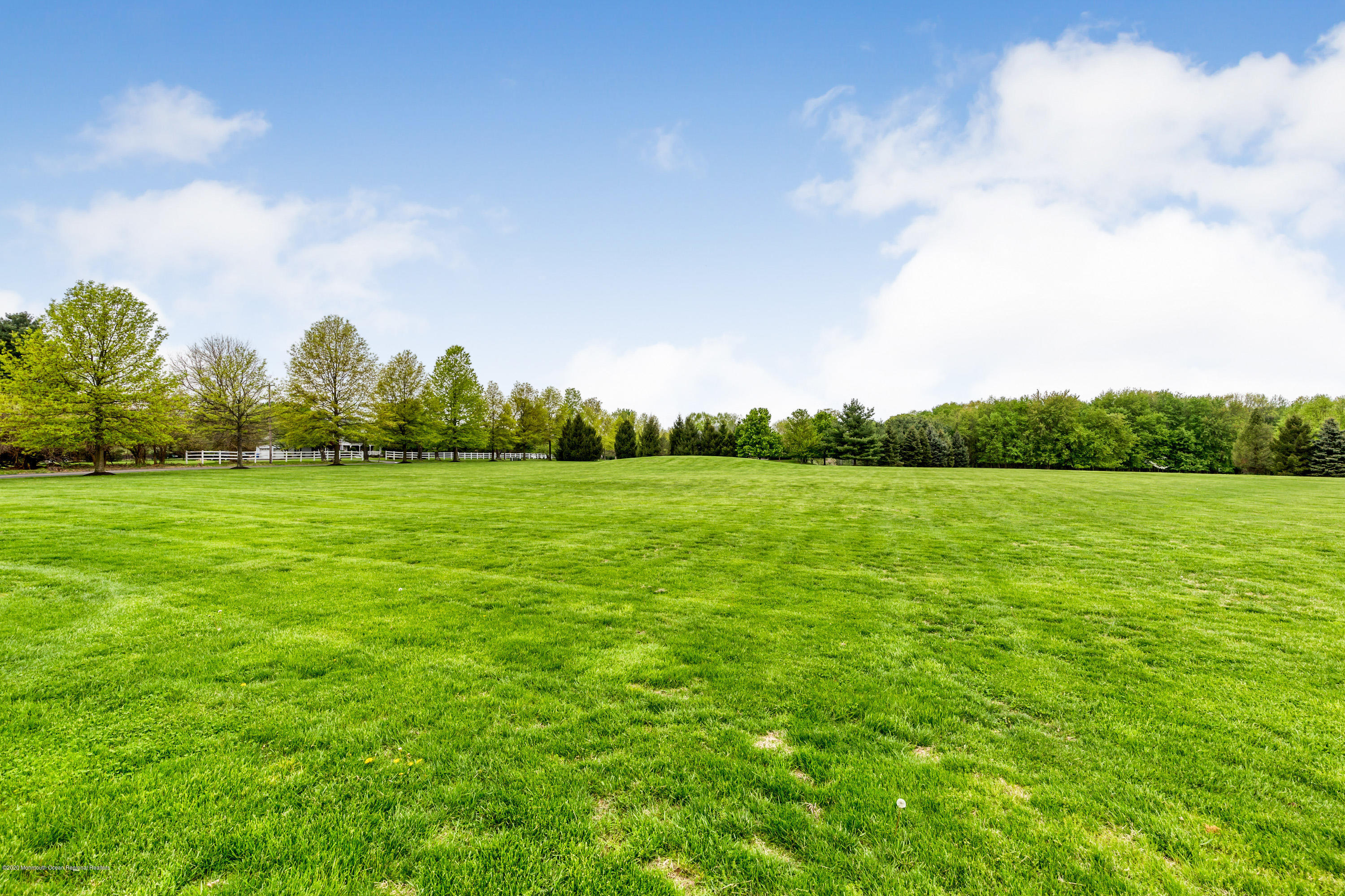 158 Otto Road Neshanic Station, NJ 08853 - Photo 8 of 50 a view of a green field with wooden fence