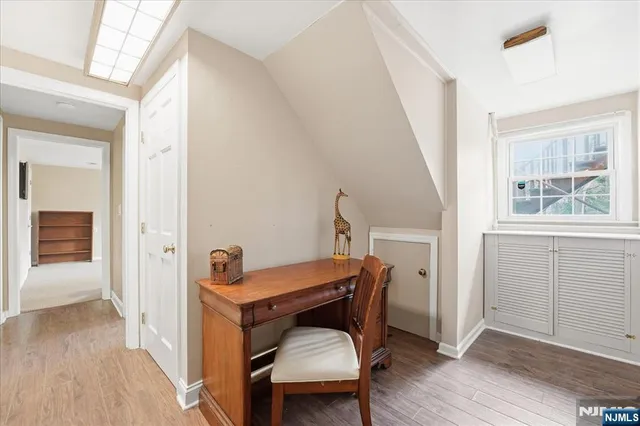 a room with a table and windows