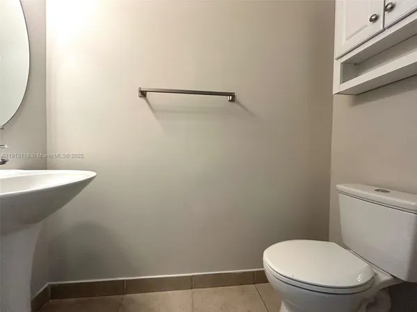a bathroom with a toilet and a sink