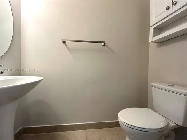 a bathroom with a toilet and a sink