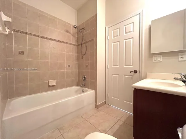 a bathroom with a sink a bathtub and a shower