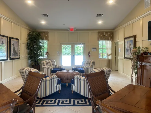 a view of a livingroom with furniture window and wooden floor