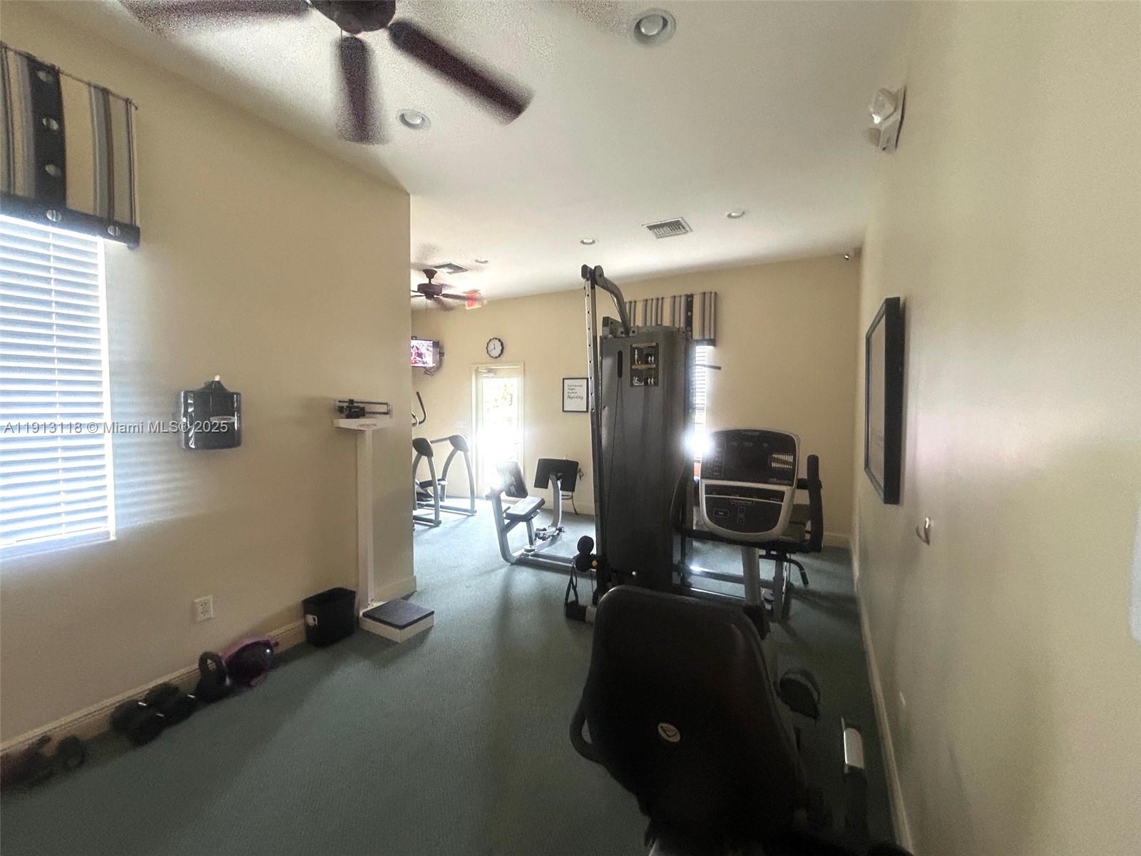 1560 Southeast Wilshire Place, Unit 103 Stuart, FL 34994 - Photo 33 of 33 a view of a room with gym equipment