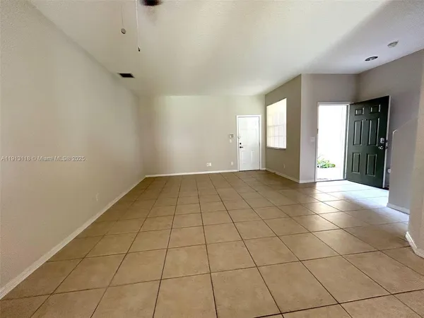 a view of an empty room and window