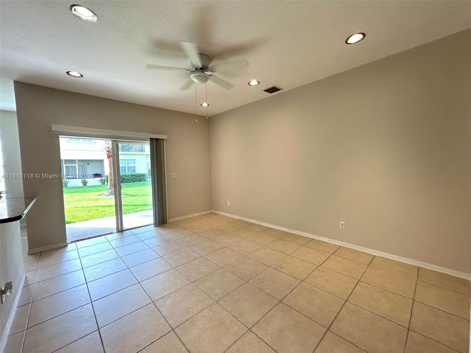 1560 Southeast Wilshire Place, Unit 103 Stuart, FL 34994 - Photo 6 of 33 a view of an empty room with a window