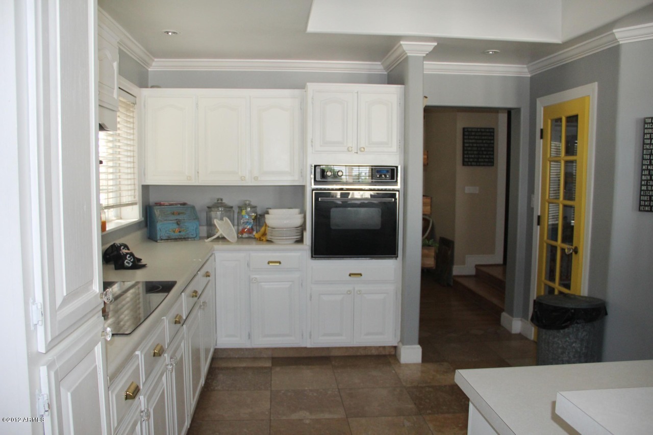 2210 North Gentry Mesa, AZ 85213 - Photo 5 of 11 a kitchen with a refrigerator and a stove top oven