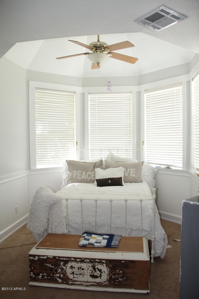 2210 North Gentry Mesa, AZ 85213 - Photo 8 of 11 a living room with furniture and a chandelier