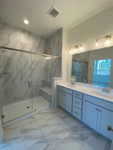 a bathroom with a sink and mirror