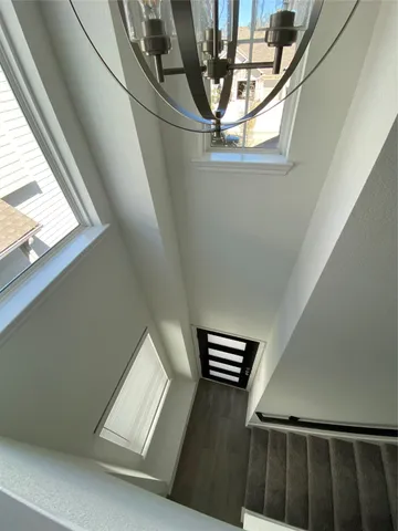 a view of staircase with wooden floor