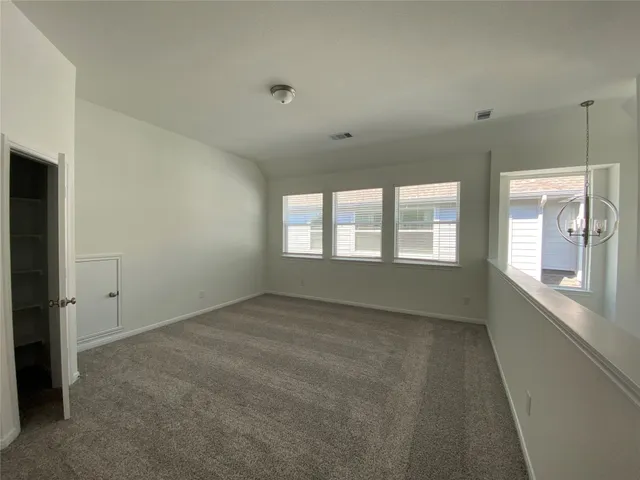 a view of an empty room and window