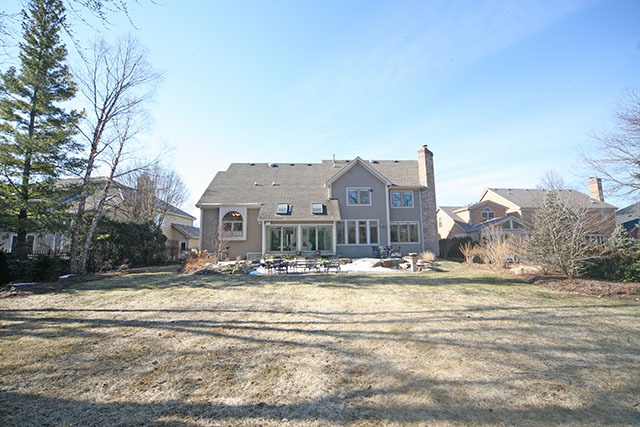 26W400 Churchill Road Winfield, IL 60190 - Photo 2 of 24 a view of houses with snow on the road