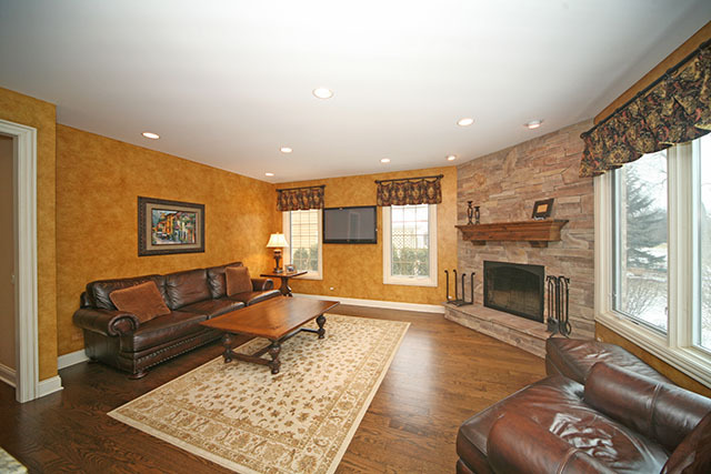 26W400 Churchill Road Winfield, IL 60190 - Photo 11 of 24 a living room with furniture and a fireplace
