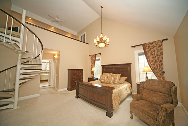 26W400 Churchill Road Winfield, IL 60190 - Photo 13 of 24 a bedroom with furniture and a chandelier