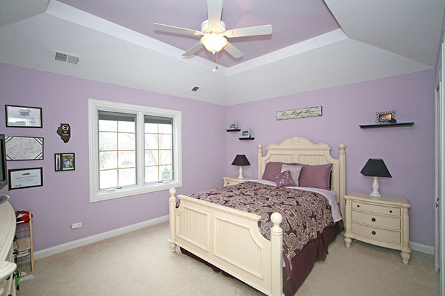 26W400 Churchill Road Winfield, IL 60190 - Photo 21 of 24 a bedroom with a bed and a ceiling fan