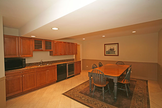 26W400 Churchill Road Winfield, IL 60190 - Photo 24 of 24 a kitchen with stainless steel appliances granite countertop a sink table and chairs