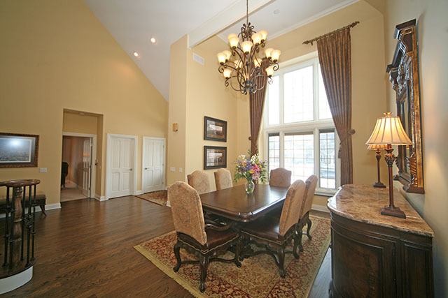 26W400 Churchill Road Winfield, IL 60190 - Photo 5 of 24 a dining room with wooden floor and chandelier