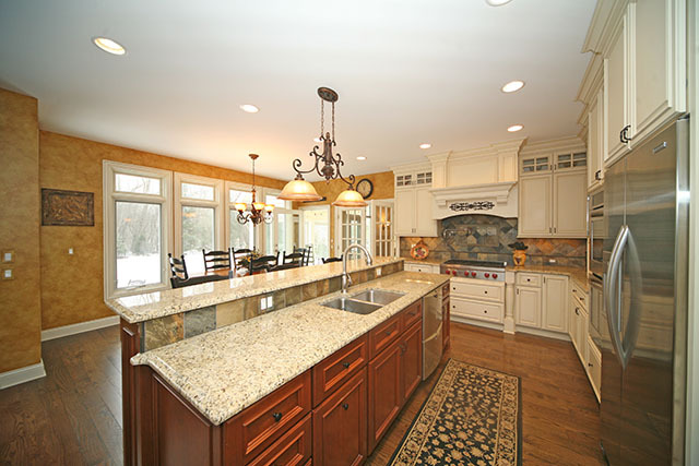 26W400 Churchill Road Winfield, IL 60190 - Photo 8 of 24 a kitchen with stainless steel appliances granite countertop a sink stove and refrigerator