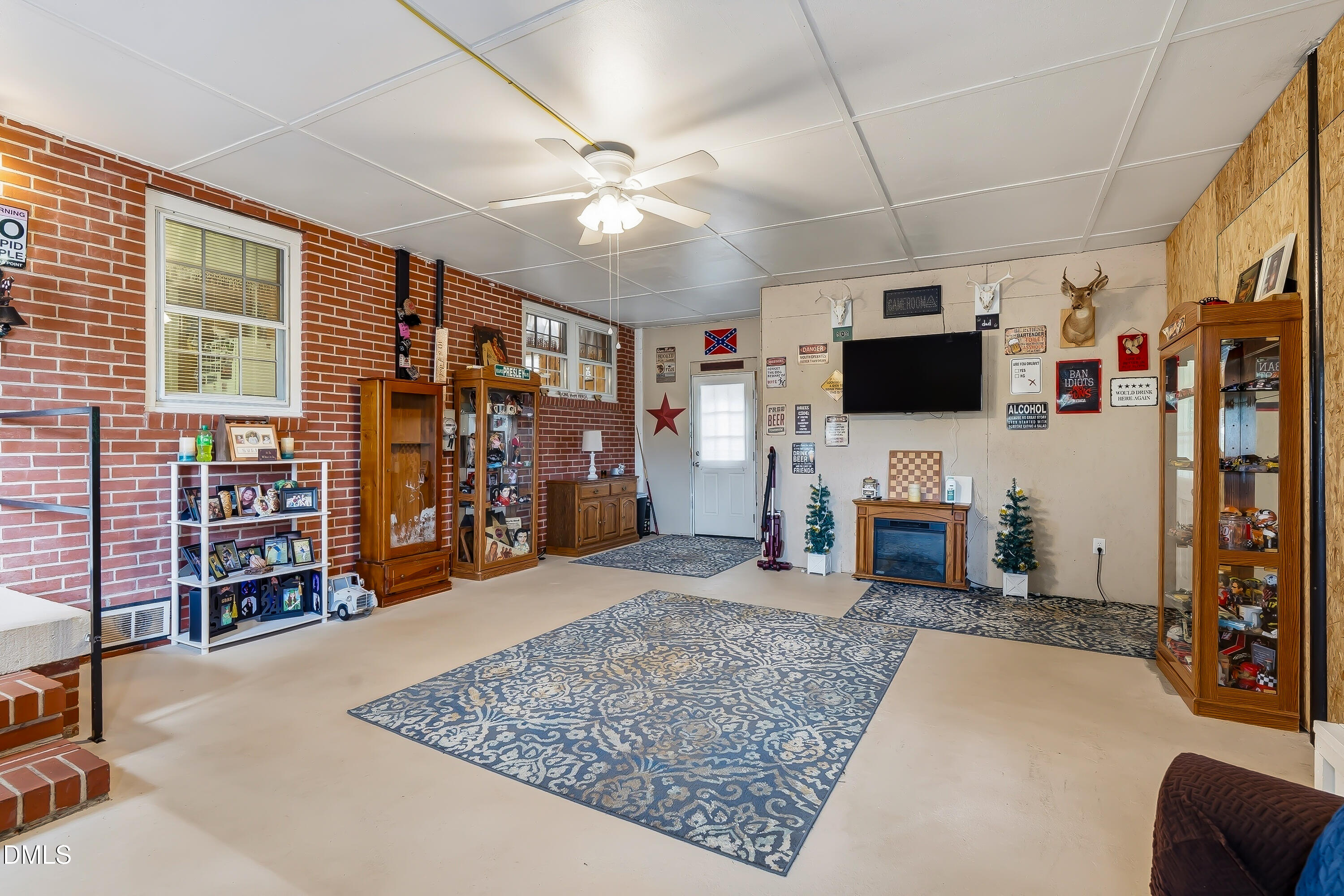4967 Highway 581 Spring Hope, NC 27882 - Photo 33 of 44 a living room with furniture and a flat screen tv