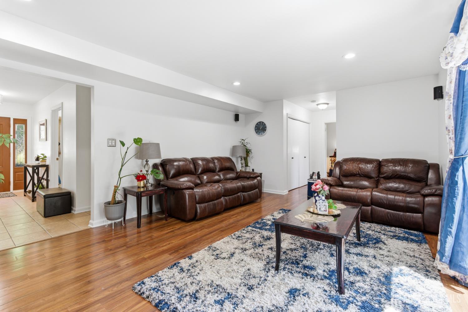213 Normandy Road Edison, NJ 08820 - Photo 12 of 45 a living room with furniture and wooden floor