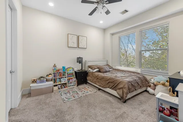 a bedroom with a bed furniture and a window