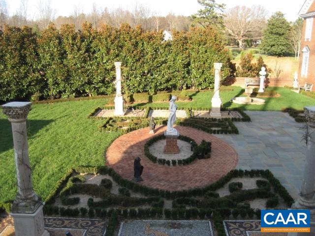a backyard of a house with yard and outdoor seating