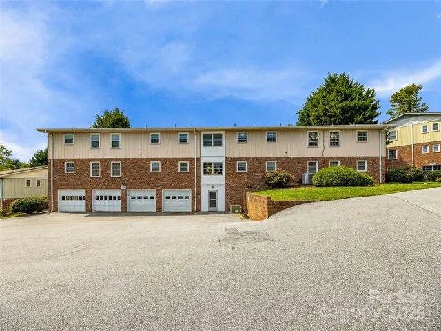 a front view of building with yard