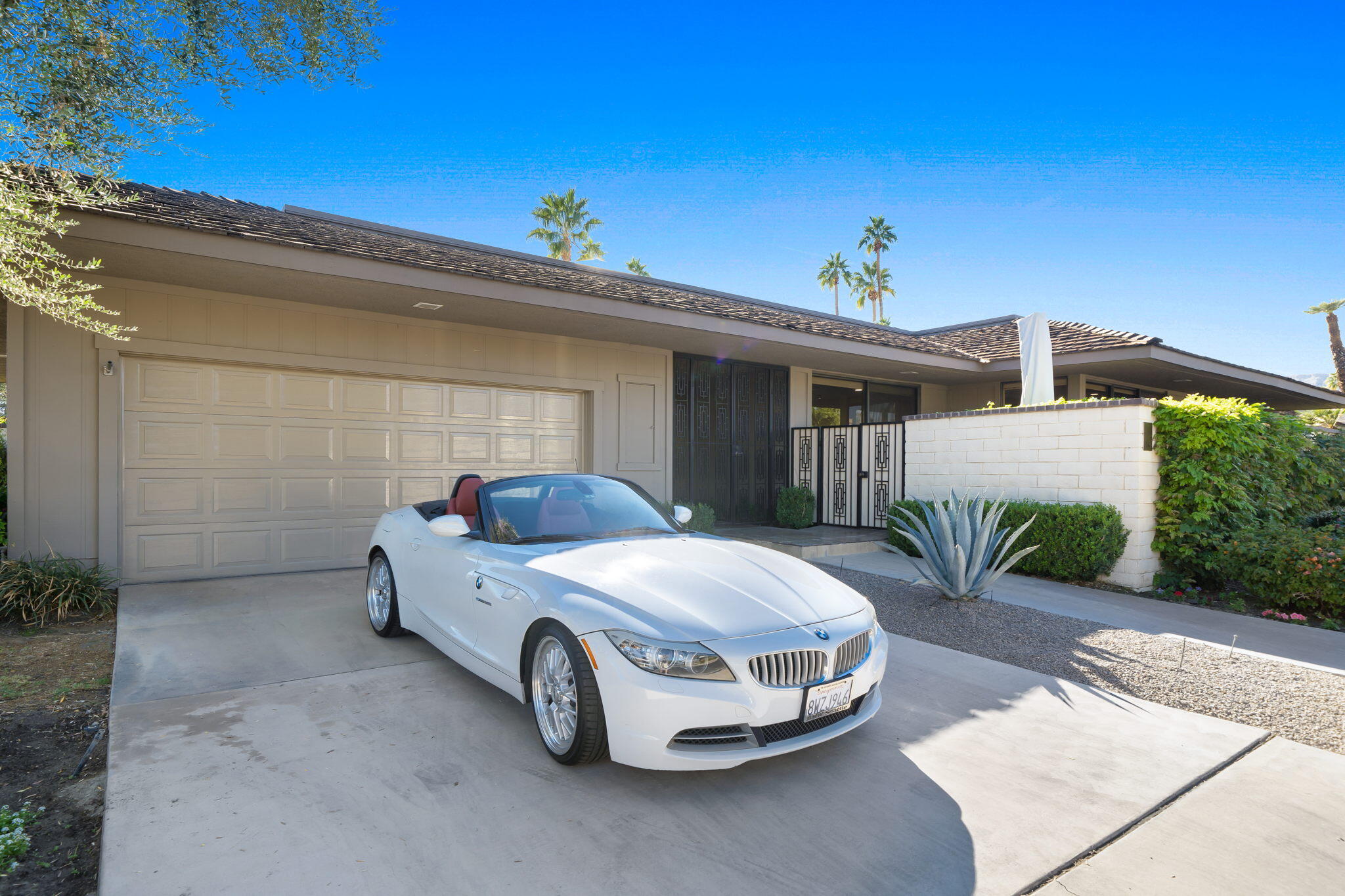 18 Lehigh Court Rancho Mirage, CA 92270 - Photo 1 of 53 a car parked in front of white house