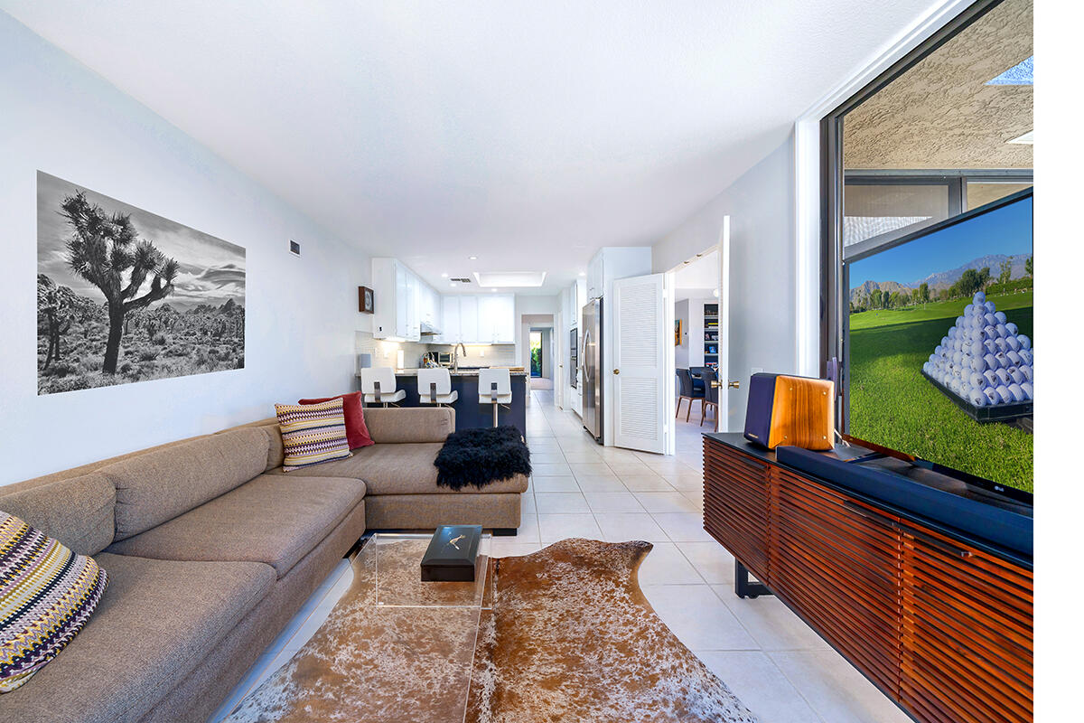 18 Lehigh Court Rancho Mirage, CA 92270 - Photo 19 of 53 a living room with furniture and a flat screen tv
